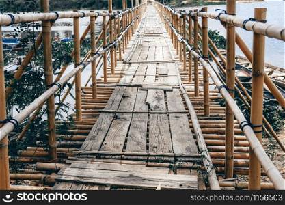 wooden bridge footbridge walkway pathway crossing river