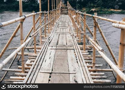 wooden bridge footbridge walkway pathway crossing river