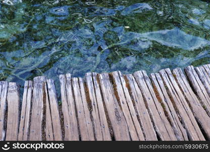 Wooden bridge for crossing over an water surface of lakes