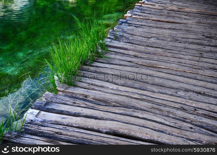 Wooden bridge for crossing over an water surface of lakes