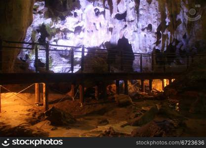 Wooden bridge in Gau Go cave, Halong bay, Vietnam