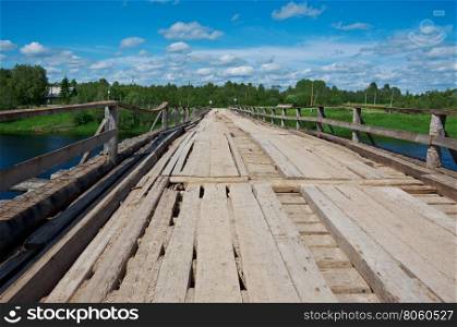Wooden bridge. Izmailovskaya village. Arkhangelsk region.the longest wooden bridge in Russia.