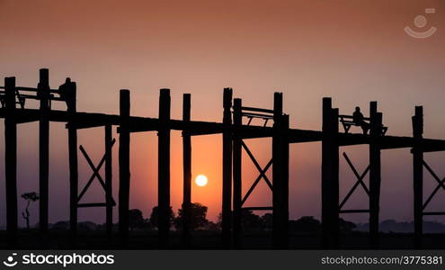 Wooden bridge of U-Bein at sunset in Amarapura