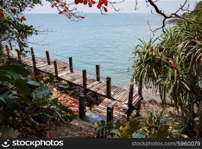 Wooden bridge on a rock by the sea