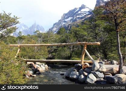Wooden bridge on the river in national park, Chalten, Argentina