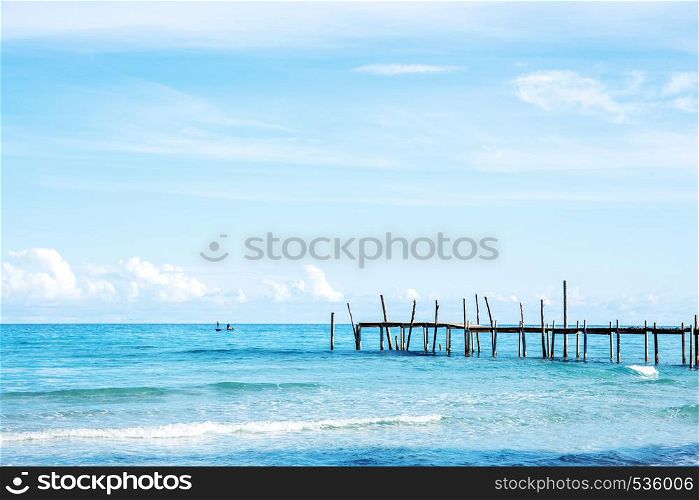 Wooden bridge on the sea with beautiful at sky.