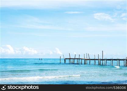Wooden bridge on the sea with beautiful at sky.