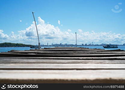 wooden bridge pier in the sea at Khao Lan, opposite with Pattaya city beach, Thailand