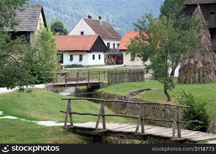 Wooden bridges and houses in village Kumrovets in Croatia