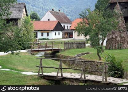 Wooden bridges and houses in village Kumrovets in Croatia