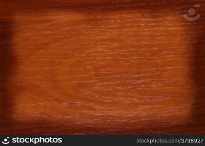 Wooden brown background with a shaded contour