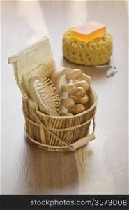 wooden bucket and bath sponge with soap