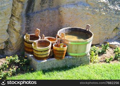 Wooden buckets and tubs in the courtyard of fortresses Guaita on Mount Titan. The Republic of San Marino