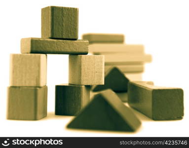 Wooden building blocks isolated on white background.