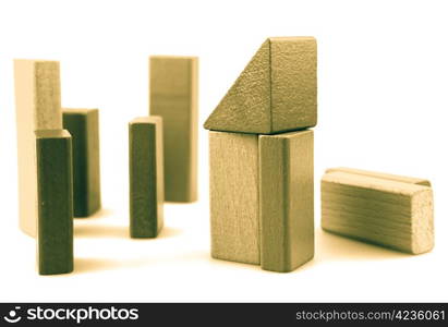 Wooden building blocks isolated on white background.