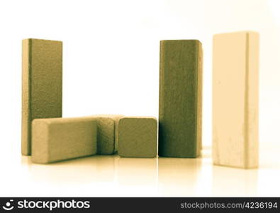 Wooden building blocks isolated on white background.