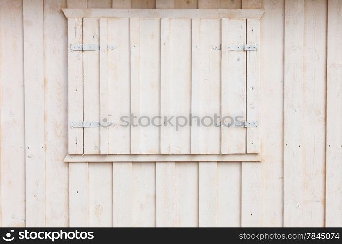 Wooden building house on beach. Window on wooden white house wood background