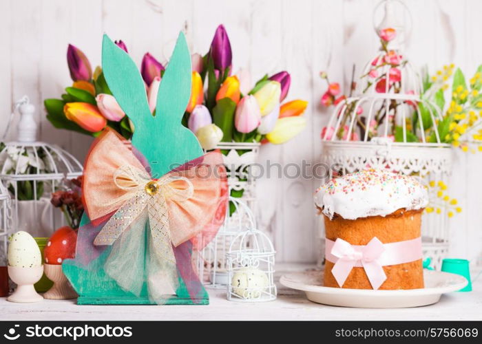 Wooden bunny - Easter decoration on the table. Easter chicken