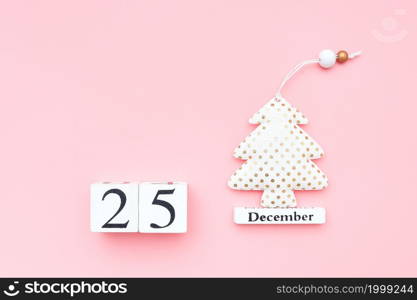 Wooden calendar December 25, textile christmas tree on pink background. Merry christmas concept. Top view Flat lay Template for design, greeting card, postcard.. Wooden calendar December 25, textile christmas tree on pink background. Merry christmas concept. Top view Flat lay Template for design, greeting card, postcard