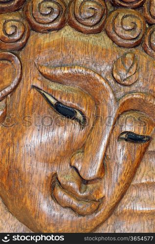 Wooden carving Buddha portrait souvenir of Thailand