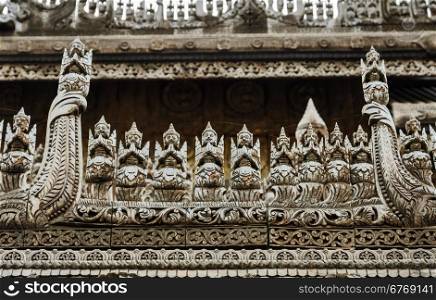 Wooden carving detail at Shwenandaw Kyaung Temple in Mandalay, Myanmar