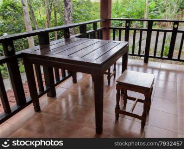 Wooden chair and table on terrace