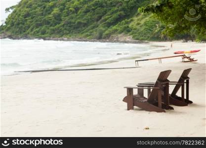 Wooden chairs on the beach. Turned out to sea on Koh Samet Thailand