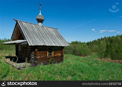 wooden chapel in the field.Arkhangelsk region of Russia.