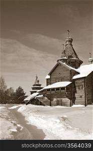 wooden chapel in winter village, sepia