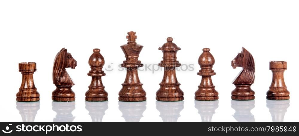 Wooden chess. Set of chess figures. Chess pieces isolated on white background.