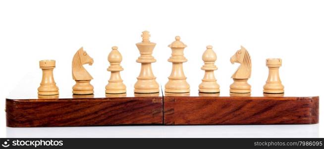 Wooden chess. Set of chess figures. Chess pieces isolated on white background.