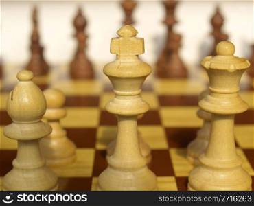 Wooden chessboard with light and dark wood checkers. Chessboard