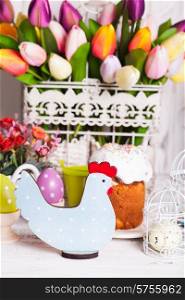 Wooden chicken - Easter decoration on the table. Easter chicken