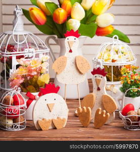 Wooden chickens figures - Easter decorations on the table. Easter decorations on the table