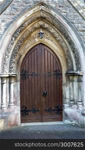 Wooden church door Gothic style