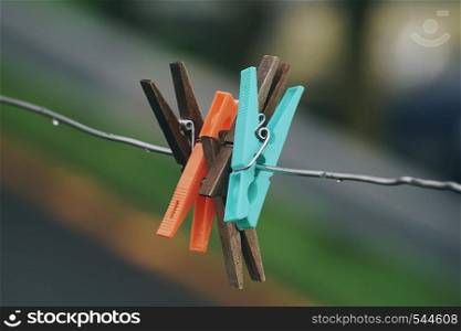 wooden clothespin in the rope abandoned in the street