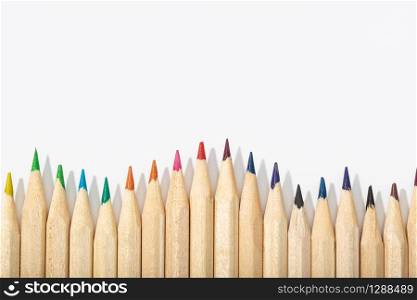 Wooden Colored pencils isolated on white background.Top view Copy space