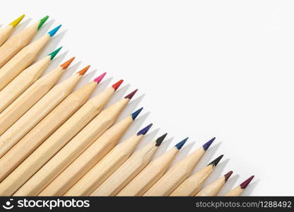 Wooden Colored pencils isolated on white background.Top view Copy space