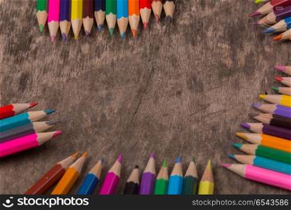 Wooden colorful pencils on a old wooden background. colorful pencils