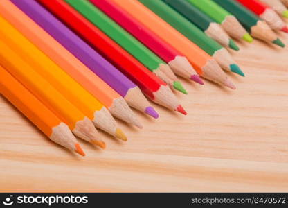 Wooden colorful pencils, on wooden table. colorful pencils