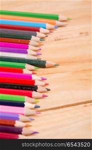 Wooden colorful pencils, on wooden table. colorful pencils