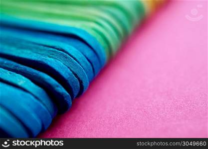 wooden colorful sticks decoration, multi colored background
