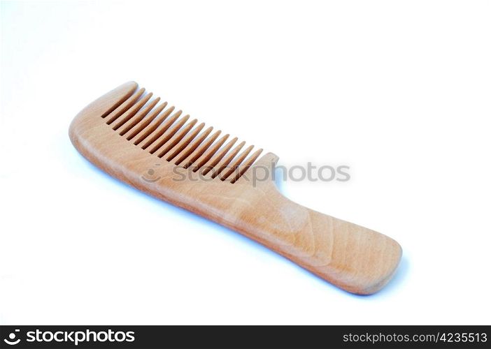 Wooden comb on a white background