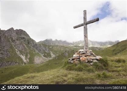 wooden cross in mountains of the french region haute savoie
