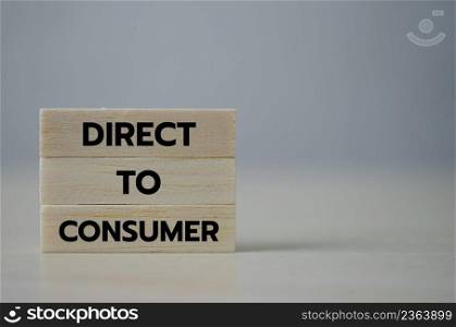 wooden cube block icon Direct to Consumer D2C on table.Business marketing Concept.