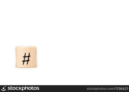 Wooden cube with hashtag isolated on white background, social media concept with space for text close-up. Wooden cube with hashtag isolated on white background, social media concept with space for text