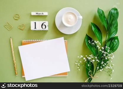 Wooden cubes calendar March 16. Notepad, cup of coffee, bouquet flowers on green background. Concept hello spring Creative Top view Flat lay Mock up.. Wooden cubes calendar March 16. Notepad, cup of coffee, bouquet flowers on green background. Concept hello spring Top view Flat lay Mock up