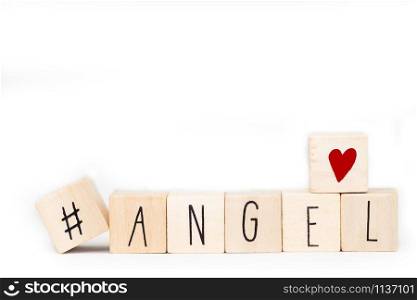 Wooden cubes with a hashtag and the word Angel isolated on white background, social media concept space for text. Wooden cubes with a hashtag and the word Angel isolated on white background, social media concept