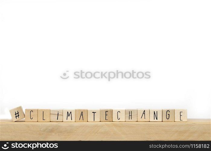Wooden cubes with a Hashtag and the word Climate Change, social media and environment concept near white background space for text. Wooden cubes with a Hashtag and the word Climate Change, social media and environment concept near white background