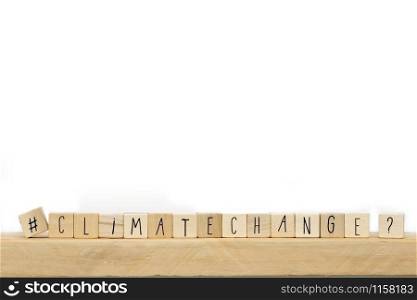 Wooden cubes with a Hashtag and the word Climate Change, social media and environment concept near white background space for text. Wooden cubes with a Hashtag and the word Climate Change, social media and environment concept near white background
